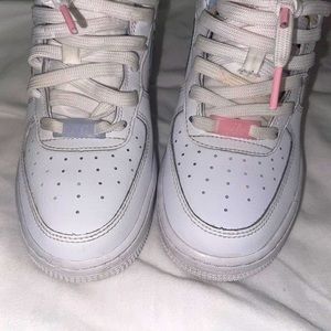 These are Nike 1 shoes kids white, pink, and blue air forces